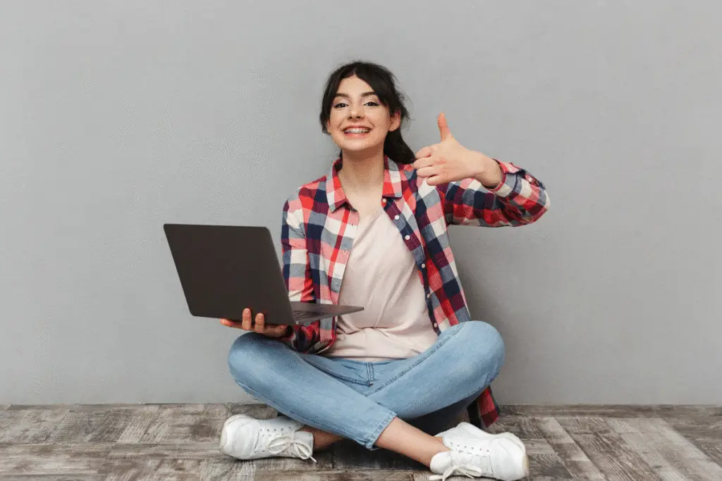Happy student with laptop